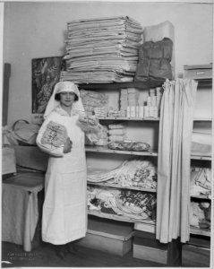 Stage Women's War Relief. Peggy O'Neil has supplied hundreds of American children with yarn and knitting needles to knit - NARA - 533752