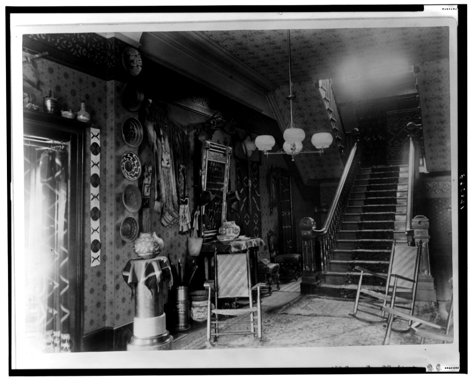 Stairhall in John Alexander Logan home showing Native American pottery, baskets, textiles, and other items, Washington, D.C. LCCN2001699698