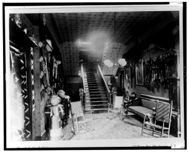 Stairhall in John Alexander Logan home showing Native American pottery, baskets, textiles, and other items, Washington, D.C. LCCN2001699677