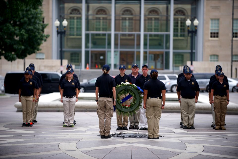 Standing at attention with wreath law enforcement explorers