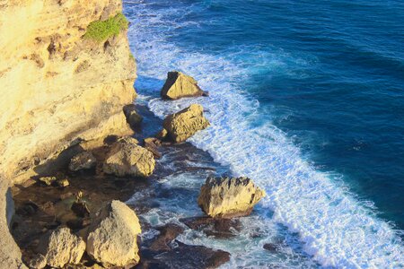 Waves rocks cliff photo