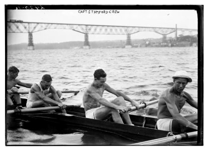 Stanford University crew rowing on Hudson River with Poughkeepsie Bridge, New York, in background LCCN2014690596