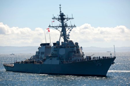 Starboard bow view of USS John S. McCain (DDG-56) with men rendering honors 120822-N-TX154-103