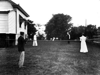 StateLibQld 1 137823 Group playing tennis on the grass court at Poul Poulsen's residence, ca. 1910