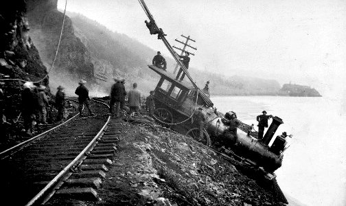 Steam locomotive No 47 of Oregon RR & Navigation derailed in the Columbia River Gorge, 1880's