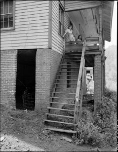 Steps leading to the front porch of the Elige Hicks family. These steps are in such bad condition that the carpenter... - NARA - 541042