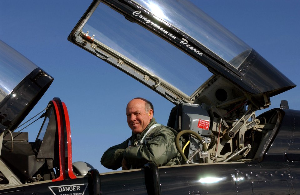 Steve Pearce unbuckles himself from a US Air Force (USAF) T-38 Talon aircraft