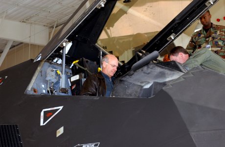 Steve Pearce sits in the cockpit of a US Air Force (USAF) F-117A Nighthawk stealth fighter photo