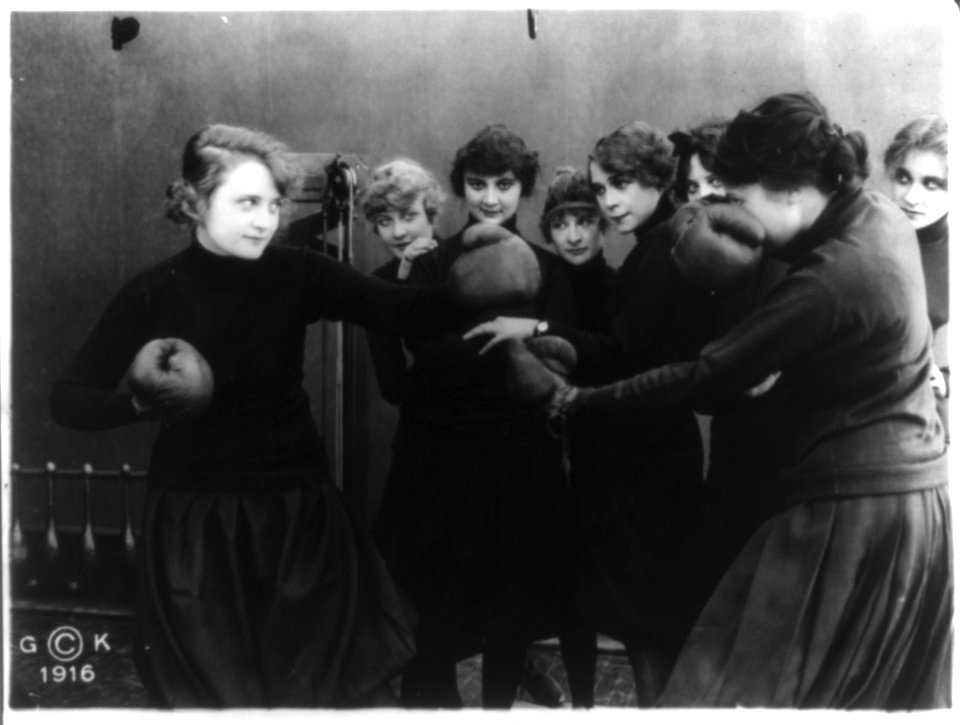 Stills of Billie Burke starring in motion picture, Gloria's Romance, 1916- boxing with woman in gymnasium (198) LCCN2004676527