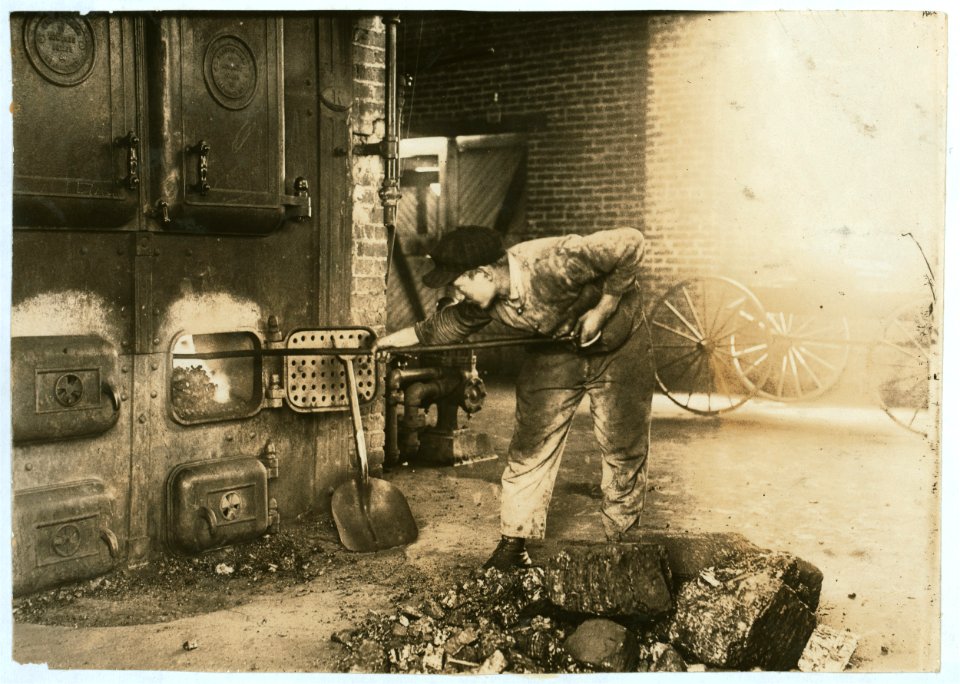 Stoking the furnace in the power-house. Pauls Valley Training School. The boy was very proud of his job. See 4833-4842. LOC cph.3b08799