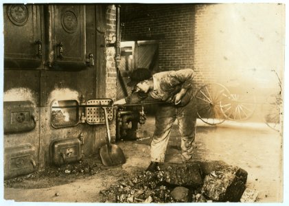 Stoking the furnace in the power-house. Pauls Valley Training School. The boy was very proud of his job. See 4833-4842. LOC cph.3b08799