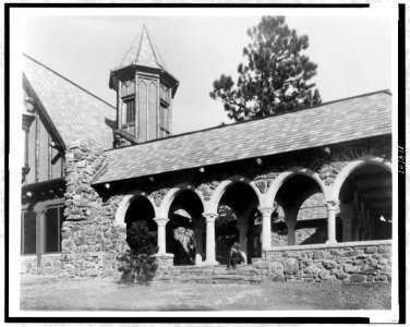 Stone mountain lodge of Paul T. Mayo, Bear Creek Cañon, Rocky Mountains, Colorado, with boy seated on step, designed by architect Jacques Benois Benedict LCCN97510541