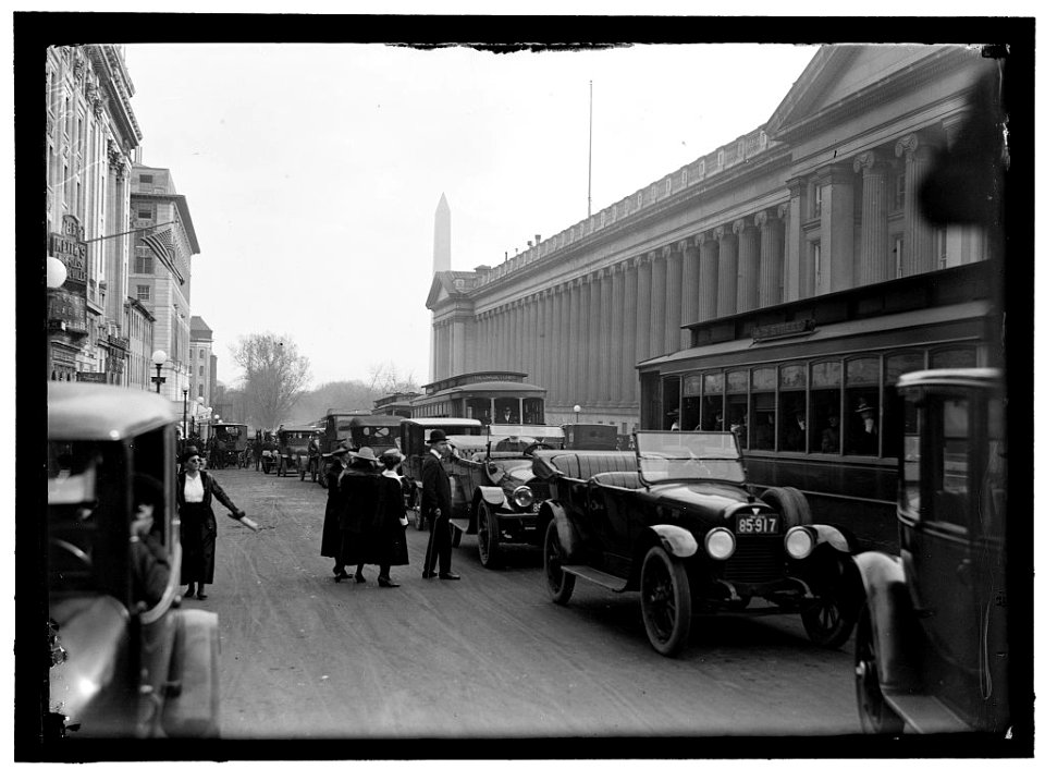 Street scene, Washington monument in background LOC hec.10546