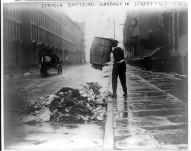 Striker emptying garbage in street - N.Y. LCCN2017645441