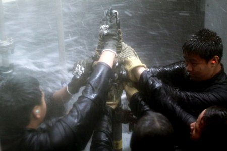 Students from Mira Mesa High School Air Force Junior Reserve Officer Training Corps (JROTC) attempt to patch a pipe while participating in the wet trainer