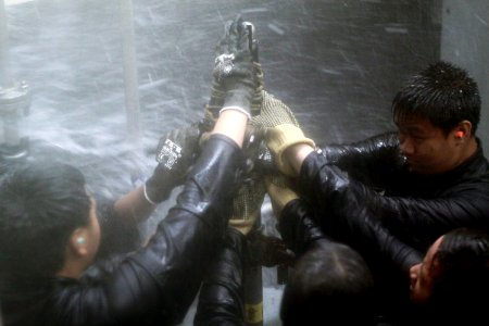 Students from Mira Mesa High School Air Force Junior Reserve Officer Training Corps (JROTC) attempt to patch a pipe while participating in the wet trainer photo