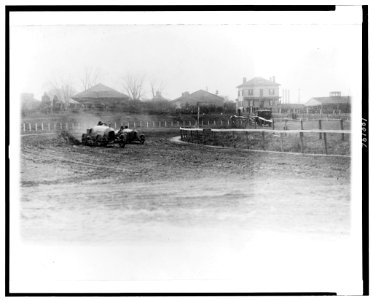 Stutz Weightman Special and another automobile going around turn on Benning race track, Washington, D.C., area on Thanksgiving Day LCCN90710638