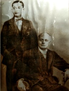Subhas Chandra Bose standing on the eve of his journey to Cambridge and seated Janakinath Bose