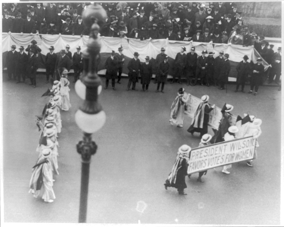 Suffragettes parading with banner President Wilson favors votes for women. N.Y.C. ca.1916 LCCN2001704196
