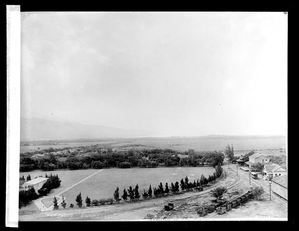 Sugar plantation. Hawaii. Showing shipping port in distance LCCN2016824459