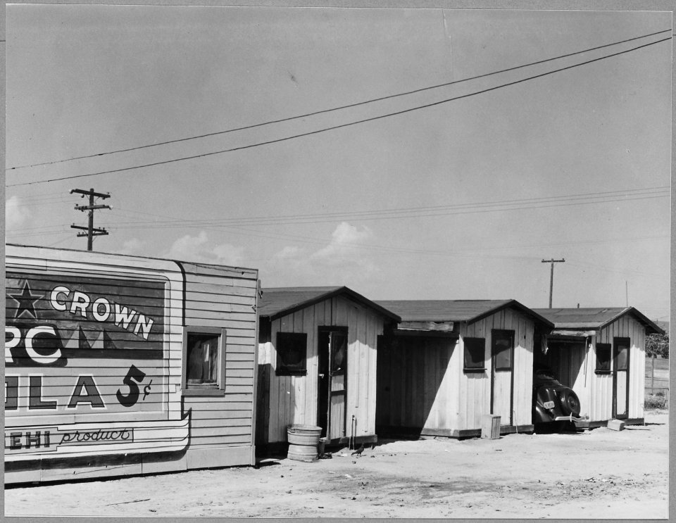 Sunset District, East Bakersfield, Kern County, California. Row of cribs adjoining recreation center . . . - NARA - 521666