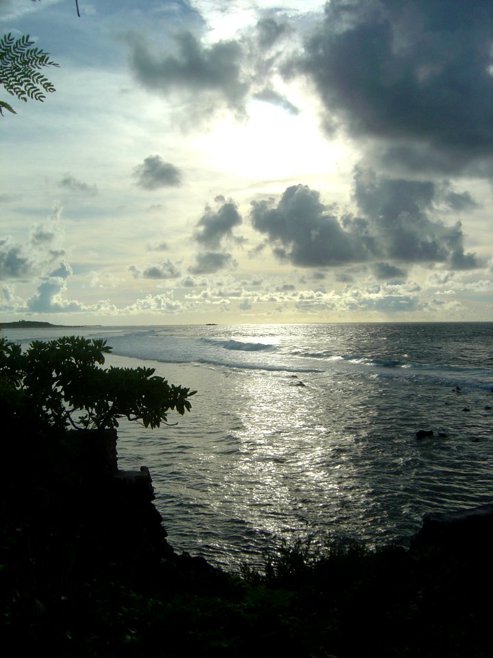 Sunshine playing off the surf in the late afternoon on the Guam coastline (line380584854)