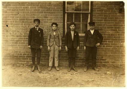 Sweepers & mule-room boys in Royal Mill, River Point, R.I. Boy left hand end, Manuel Mites has been in mill 2 years. Clinton Silvey and Louis Perry (centre boys) have been in mill one year LOC nclc.01682