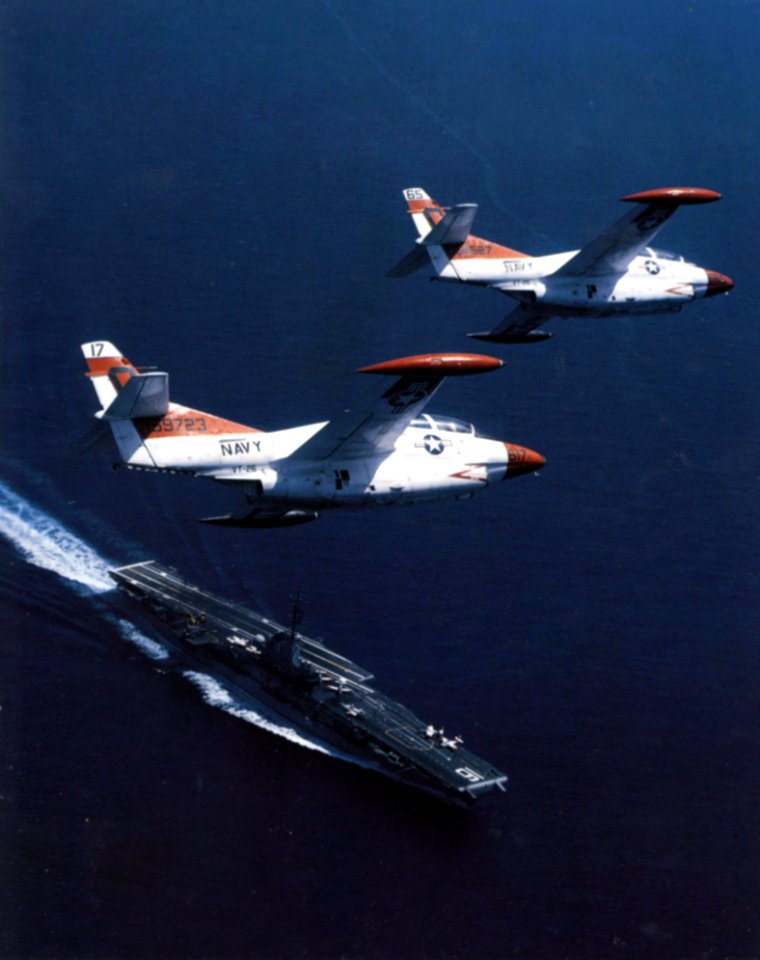 T-2Cs fly over USS Lexington (AVT-16) 1982