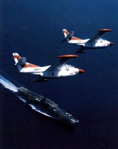 T-2Cs fly over USS Lexington (AVT-16) 1982
