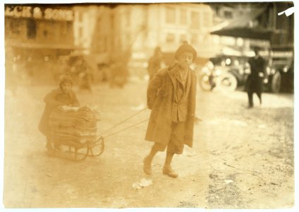 Taking bags home to be mended. 5 to 11 years old. Market. LOC nclc.05154