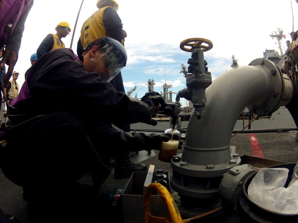 Taking a fuel sample 121020-N-NL541-410