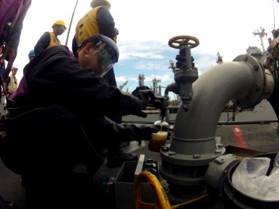 Taking a fuel sample 121020-N-NL541-410