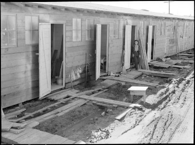 Tanforan Assembly center, San Bruno, California. Barracks for family living quarters. Each door en . . . - NARA - 537670