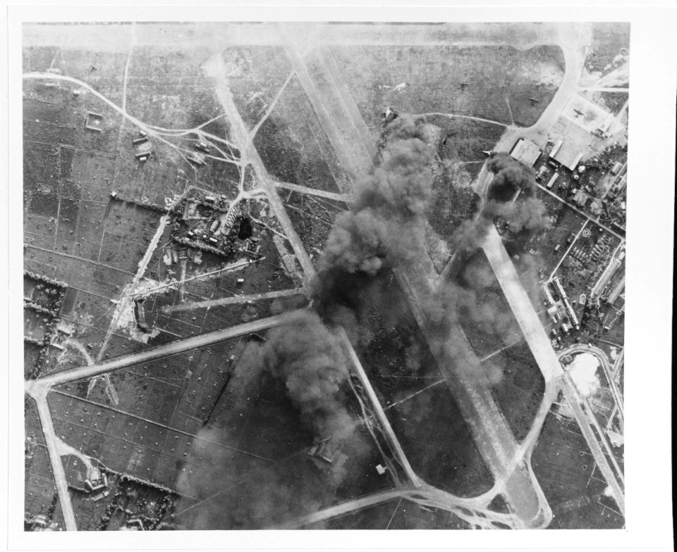 Tan Son Nhut airfield, Saigon, Indochina, under attack by U.S. Navy aircraft, 12 January 1945 (80-G-301000)