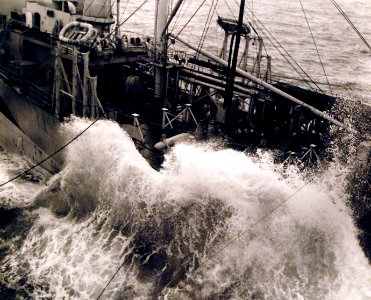 Tanker refueling USS Enterprise (CV-6) in rough seas October 1944 (80-G-298118)