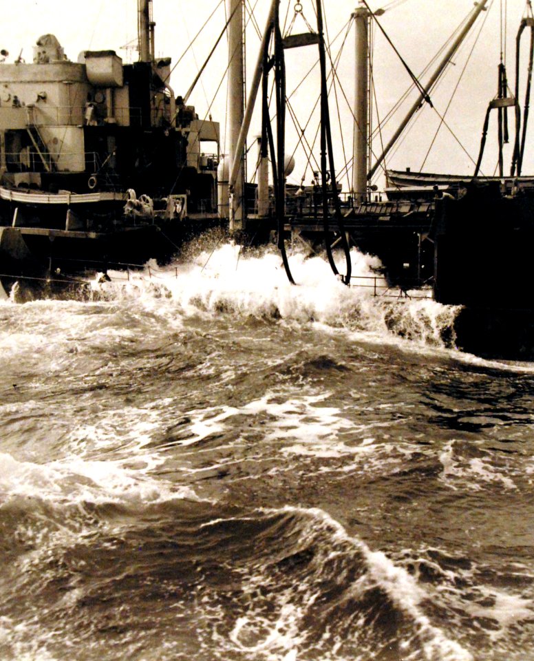 Tanker refueling USS Enterprise (CV-6) in rough seas (80-G-298117)