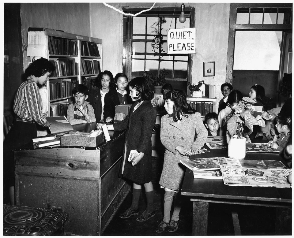 Taos County, New Mexico. Children crowd into the Harwood Branch Library after school at Ranchos. I . . . - NARA - 521983