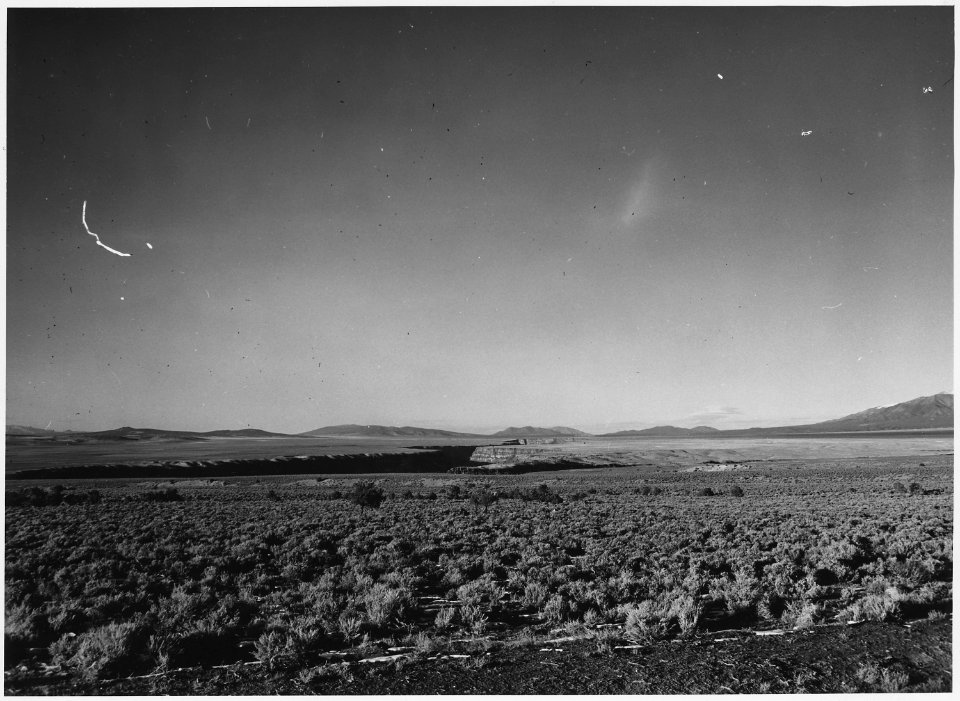 Taos County, New Mexico. Channel of the Rio Grande divides dry farming land, to the west (left of p . . . - NARA - 522003