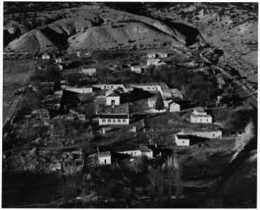 Taos County, New Mexico. View of Valdez. Note layout of houses in square around the church, a styl . . . - NARA - 521935