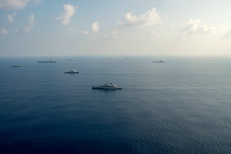 Ten ships and submarines from the Indian, Japanese and U.S. navies maneuver into a close formation during Exercise Malabar 2015