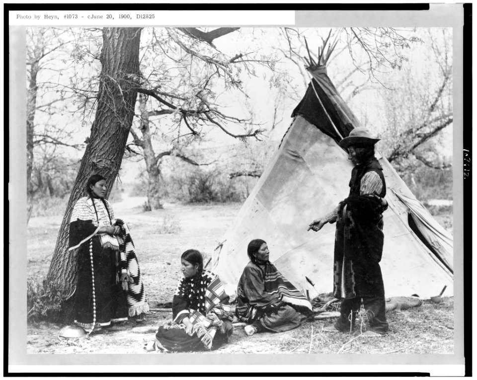 Tasunki Witko and three women outside tepee LCCN93504375