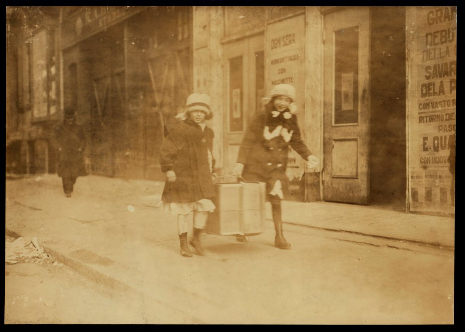 Team-work. Carrying flowers home. Thompson St., N.Y. LOC nclc.04187