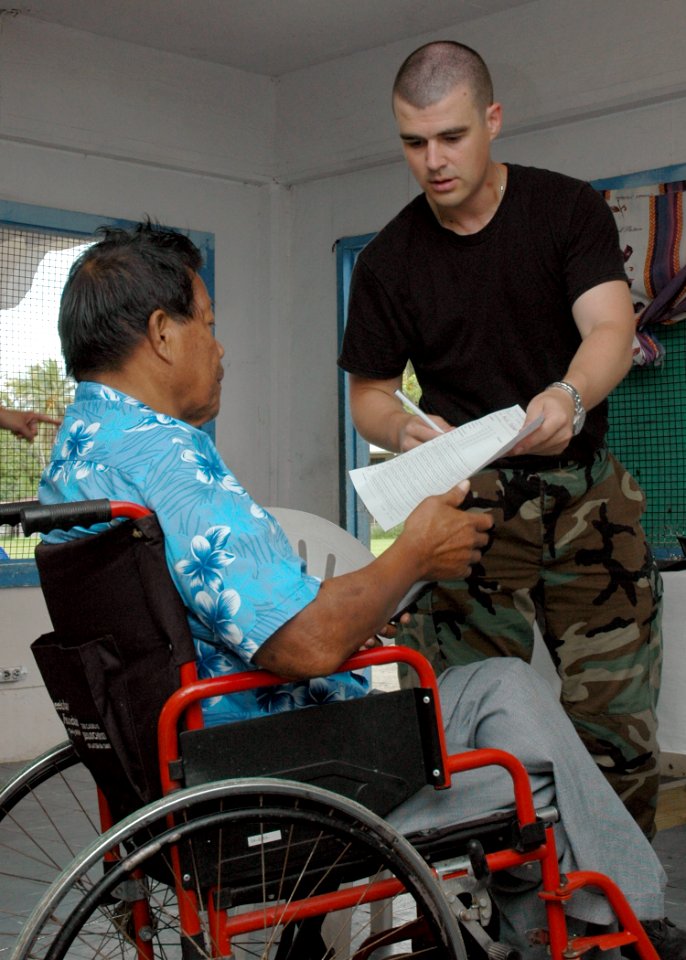 Tech. Sgt Rayno Boivin assists a patient DVIDS55313