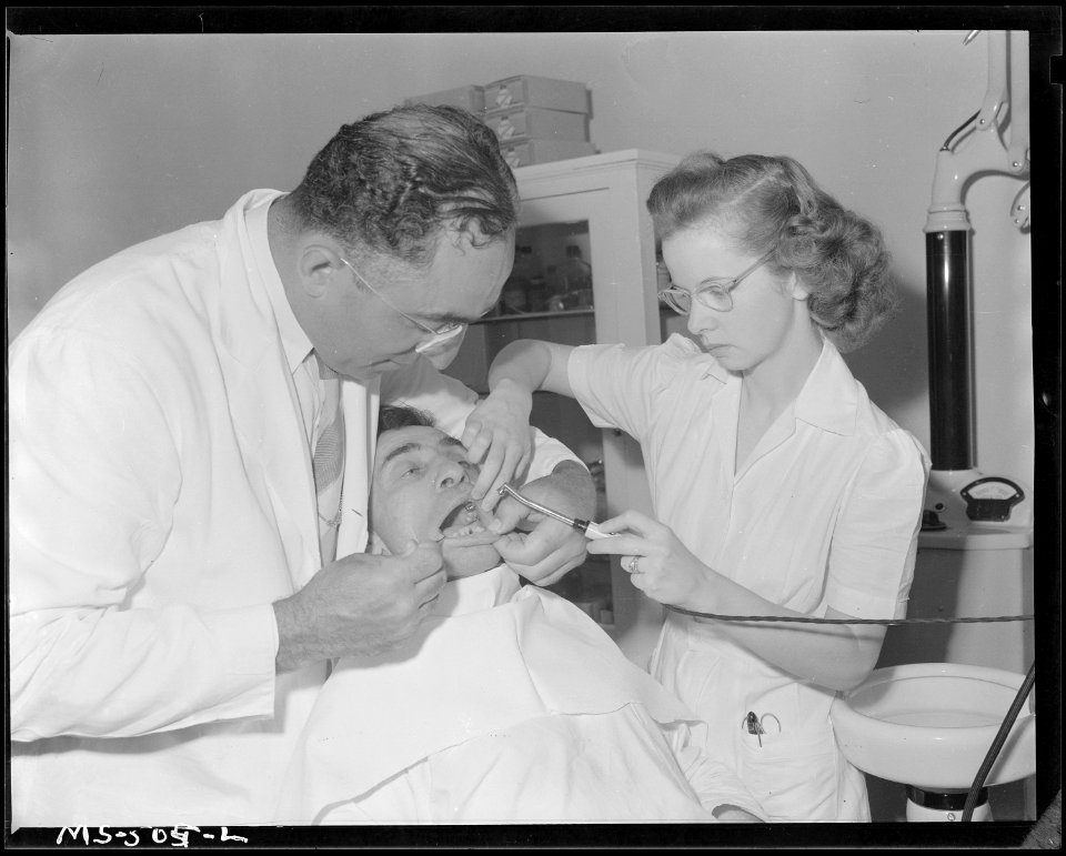 Telesfro Deluna, miner, has his teeth examined by dentist in company owned hospital here. Colorado Fuel & Iron... - NARA - 540453