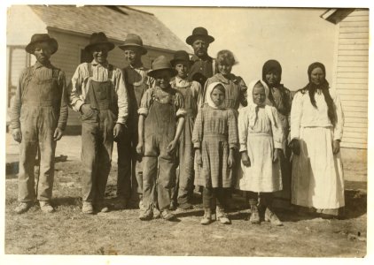 The 8 and 10 yr. old children here are working beets on a farm near Sterling, Colo, from 5-00 A.M. to 7-00 P.M. on rush days. Father said, 'We have to get done.' LOC nclc.00343