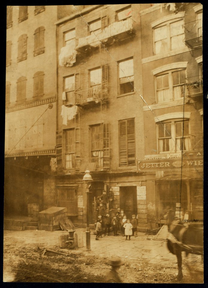 Tenement house with children in front. Possibly 36 Laight St LOC nclc.04078