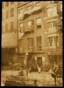 Tenement house with children in front. Possibly 36 Laight St LOC nclc.04078