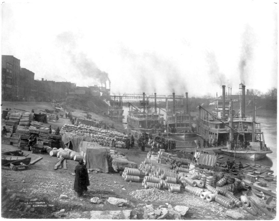 Tenn. - Nashville - four riverboats (sternwheelers) tied up at riverbank barrels, sacks, palettes, and rolls of wire LCCN2007678200