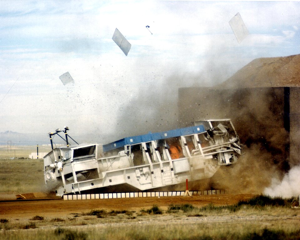 TEST RAIL CAR CARRYING SPENT NUCLEAR FUEL SHIPPING CASK