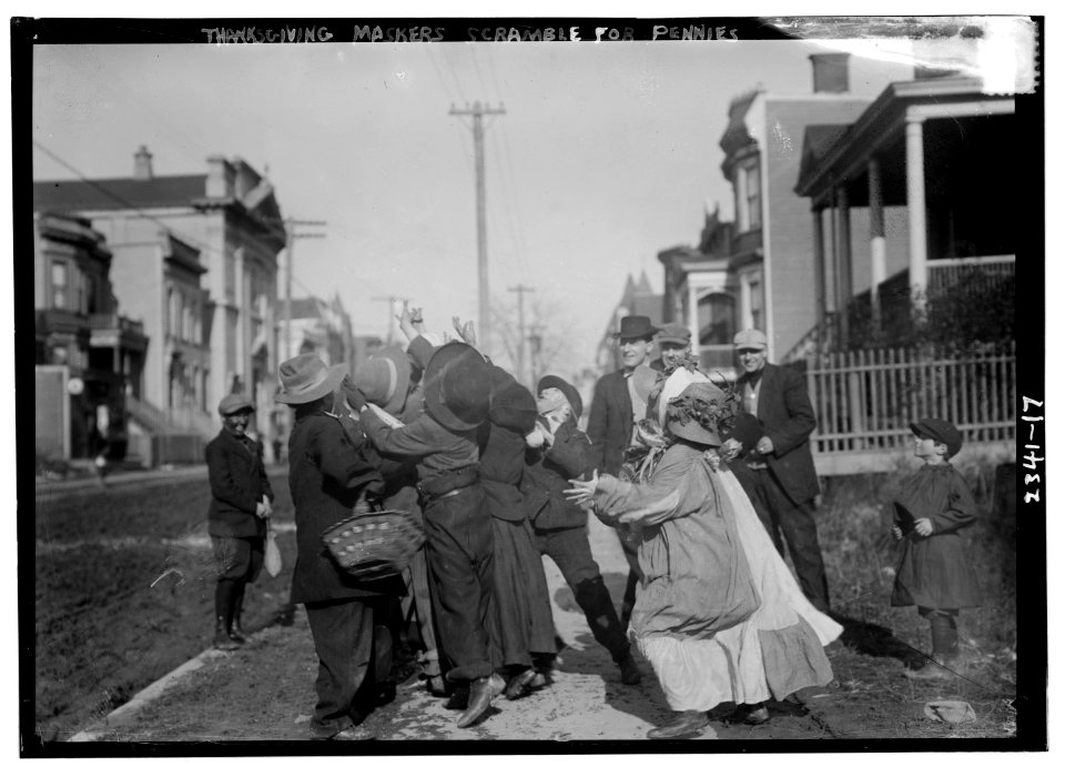 Thanksgiving Maskers scramble for pennies LCCN2014689996